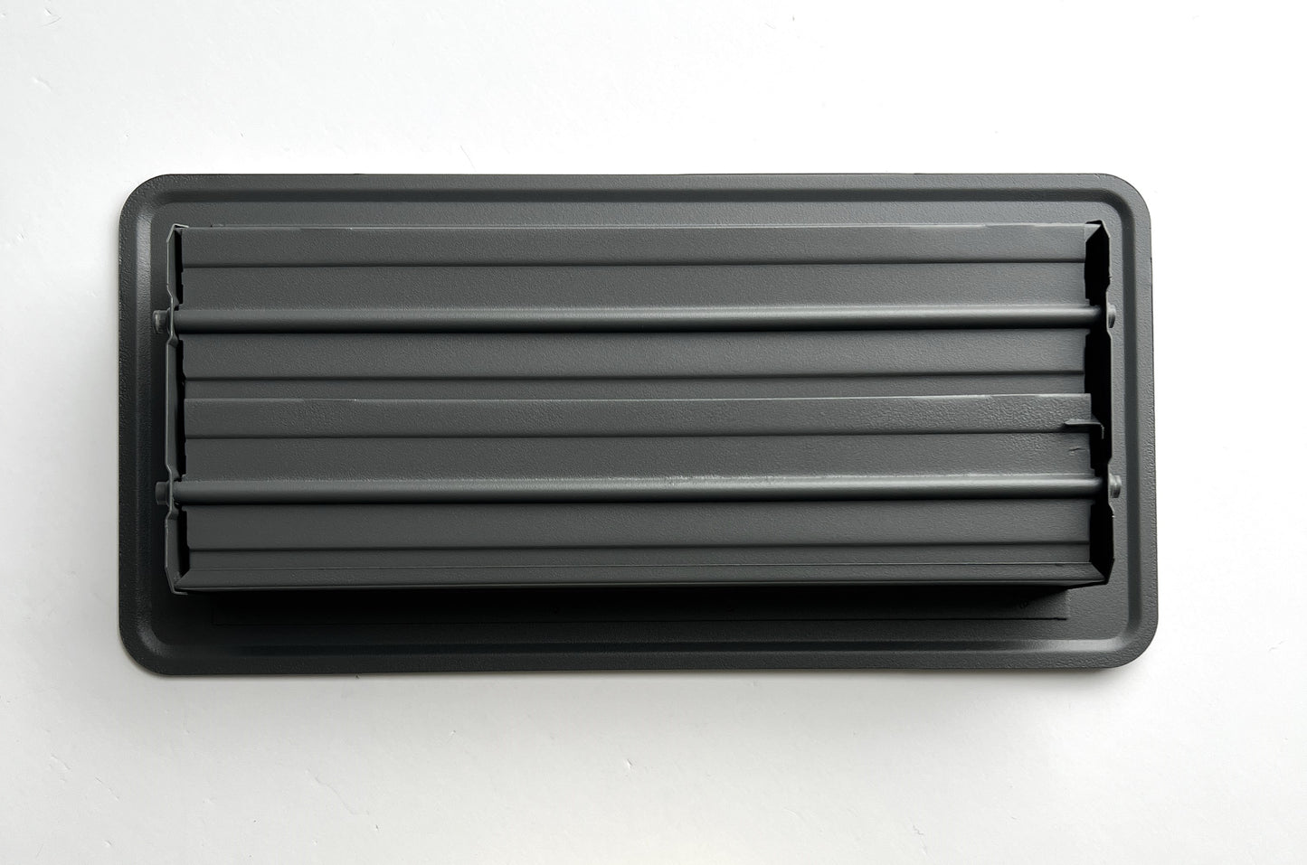 Heavy Duty Steel Decorative Slotted face Floor Vent with Beautiful Black Matte Finish. Fits in 4 x 10 Duct Opening. Overall Dimension is 5.75 in Wide x 13.75 in Long